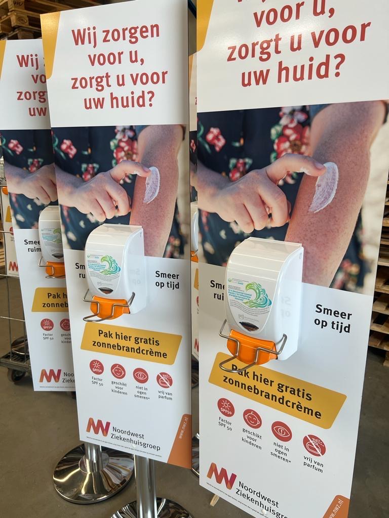 Sunscreen use signage with a dispenser attached #4