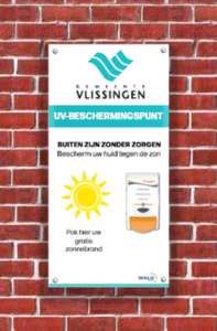 Sunscreen use signage with a dispenser attached on the wall